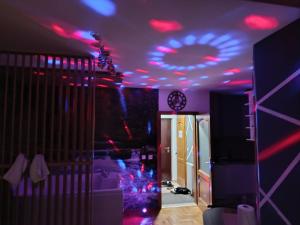 a room with purple and red lights on the ceiling at JACUZZI for RELAX - HOLLYWOOD Apartment, STUP, Sarajevo near Airport in Sarajevo +78 photos