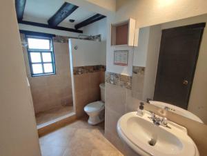 a bathroom with a sink and a toilet at La tranquera hotel in Villa de Leyva +35 photos