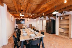 a large dining room with a long table and chairs at Neobyčejný Sklep in Pavlov