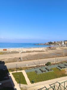 a view of a beach and the ocean at Los Molles apartment in Los Molles