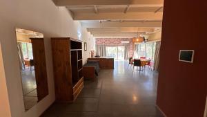 a hallway with a living room and a dining room at PALMARES DEL BOULEVARD - Aeropuerto Internacional Taravella - Campus Siglo 21 - Campus Blas Pascal - Sanatorio Allende - Estadio Kempes - Quorum - Mujer Urbana - Complejo Ferial Córdoba in Córdoba