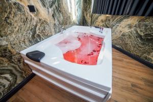 a white bath tub with a piece of fruit in it at Dual Hotel Halkalı in Istanbul +114 photos