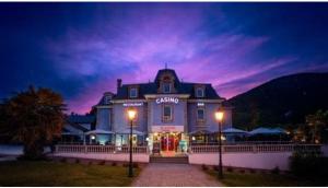 a large blue building with two lights in front of it at La soie in Allevard