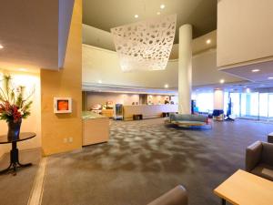 an office lobby with a reception desk and a table at hotel miura kaen in Takikawa