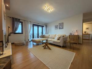 a living room with a couch and a table at The Watch Tower B in Siátista