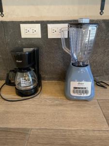 a blender sitting on a counter next to a coffee maker at Villa Colibries Chelem in Chelem