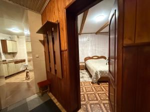 a hallway to a bedroom with a bed in it at healing waters in Skhidnitsa