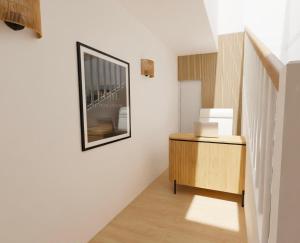 a hallway with a picture on the wall and a wooden cabinet at Hotel le Romanesque in Cannes