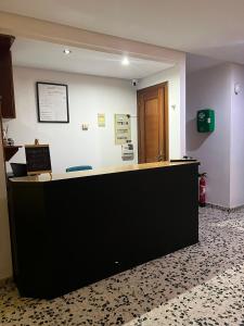 a lobby with a large counter in a room at Hotel Berna - Valdeorras - Camino de Invierno in La Rúa