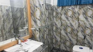 a bathroom with a sink and a shower curtain at Rawana River Edge in Ella +46 photos