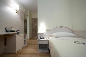 Postel nebo postele na pokoji v ubytování Giorgio e Flora Ristorante e Locanda