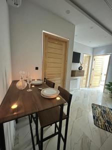 a dining room with a wooden table and chairs at issac in Monastir