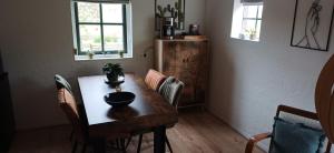a dining room table with a bowl on top of it at Bed & Breakfast Appenseweg in Voorst