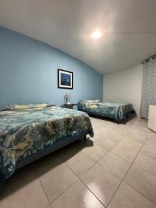 a bedroom with two beds in a room at Rosarito By The Sea in Rosarito +19 photos