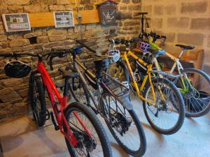 a group of bikes parked next to a wall at Chez Marie Roulotte in Pontfarcy