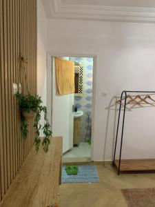 a room with a hallway with a toilet and a bathroom at Dalal Diam in Dakar