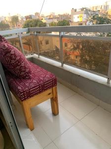 a chair sitting on top of a balcony at Dalal Diam in Dakar