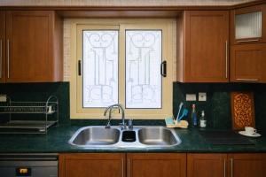 a kitchen with a sink and a window at The New Cairo 3BR Residence in Cairo +25 photos