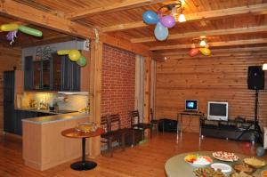 a living room with balloons hanging from the ceiling at Alevi Holiday Home with Sauna in Tallinn