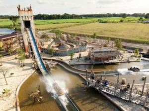 a water park with a roller coaster in the water at Strand Hotel Deichläufer in Butjadingen