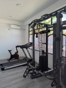 a room with a gym with two tread machines at Ranbin Retreat in Manadhoo +16 photos