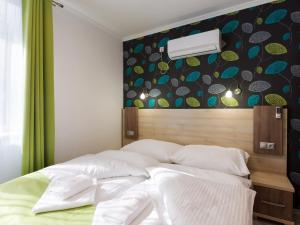 מיטה או מיטות בחדר ב-Apart-club Zora