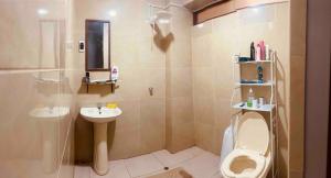 a bathroom with a toilet and a sink at Attic Hotel in Chachapoyas +31 photos