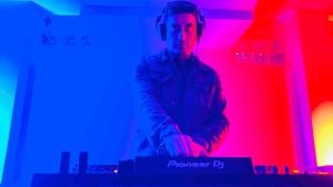 a man standing in a room with headphones at Attic Hotel in Chachapoyas