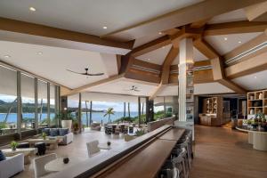 a living room with a view of the ocean at The Ritz-Carlton O'ahu, Turtle Bay in Kahuku
