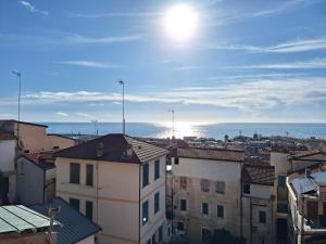 a view of a city with the ocean in the background at Casa Milda in Sanremo