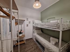 a room with two bunk beds and a window at Casa Milda in Sanremo +17 photos