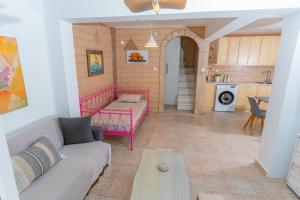 a living room with a couch and a table at Socrates House Kythnos in Kithnos