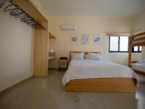 a bedroom with a large bed and a window at Ocean View-picuzzi Villa RI duplex Las Galeras in Piedra de La Ballena +17 photos