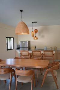 a dining room with a table and chairs at Ocean View-picuzzi Villa RI duplex Las Galeras in Piedra de La Ballena