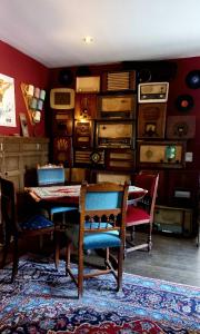 a dining room with a table and chairs at B&B Ferme1883 in Lierneux