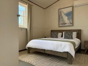 a bedroom with a large bed and a window at The Podium Accommodation - Oatlands, Tasmania in Oatlands