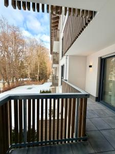a balcony with a view of a yard at GG Apartment 8 in Garmisch-Partenkirchen