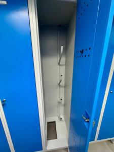 a bathroom with a blue door and a shower at GG Apartment 8 in Garmisch-Partenkirchen +5 photos