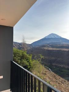 a balcony with a view of a snow covered mountain at Valle Alto in Cayma