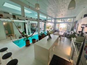 a large living room with a lot of plants at fascinating loft with swimming pool in Oaxaca City