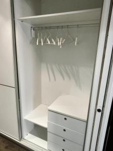 a closet with a white cabinet and a drawer at Apartamento Eguzkey - Tolosa centro in Tolosa +2 photos