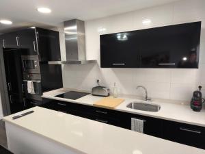 a kitchen with a sink and a counter top at Apartamento Eguzkey - Tolosa centro in Tolosa