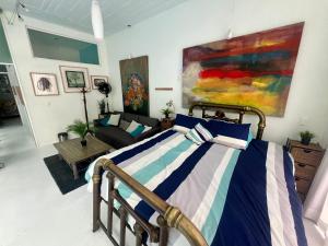 a bedroom with a bed and a living room at fascinating loft with swimming pool in Oaxaca City +27 photos