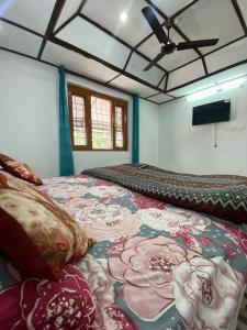 a bedroom with a large bed in a room at Nagwal Hotel in Dharamshala