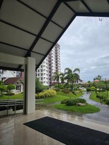 a view of a building from a patio at Kai's Luxe Balcony Suite at Royal Oceancrest Mactan in Mactan Island