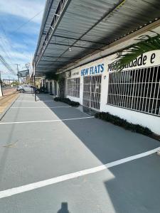 a parking lot with a new plans sign on a building at Apartamento com 3 quartos in Boa Vista +9 photos