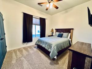 a bedroom with a bed and a window at Spacious Home in Page