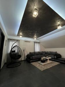 a living room with a couch and a table at Crassula Lux 2 in Surčin