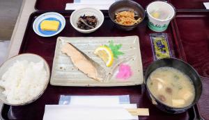 a tray of food with a fish and rice at ライベストイン奄美アネックス in Koniya
