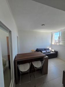 a living room with a table and two chairs at Espacio 43 Terminal in La Plata